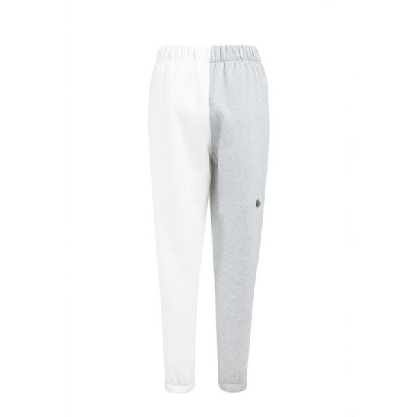 The back of two toned color blocked sweatpants, where the right leg is grey and the left leg is white.